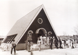 Members gather to celebrate the completion of a church