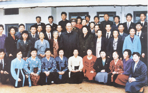 Reverend Moon with relatives in Sangsa-ri, while visiting North Korea, december 1991