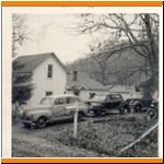 Early photo of Oak Hill, with cars.jpg